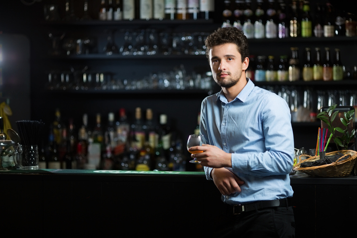 Young businessman at bar counter